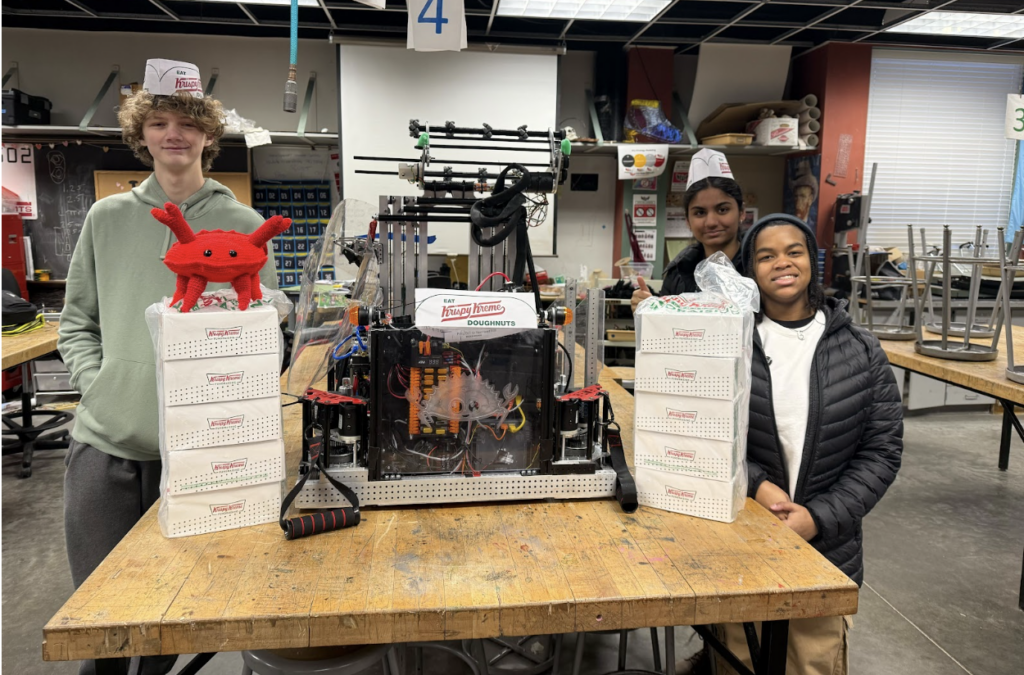 Our team members gearing up to sell boxes of donuts in the cold!